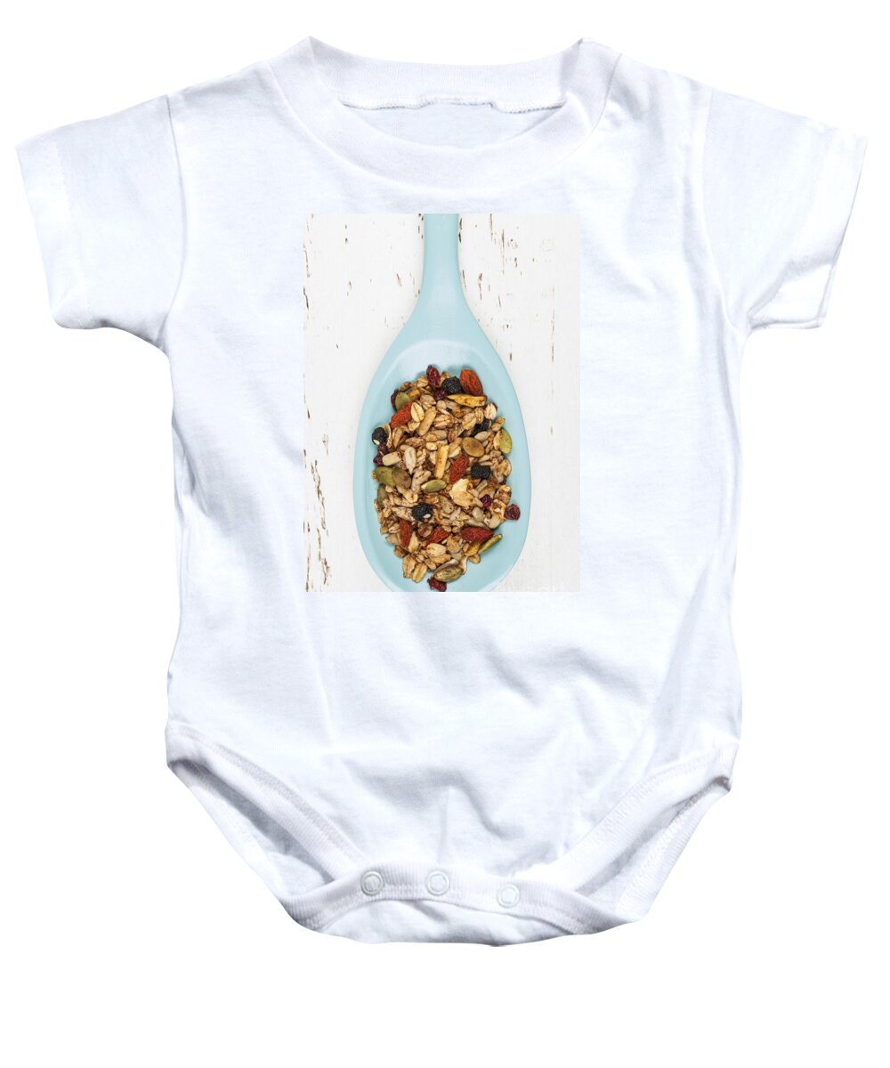Granola Baby Onesie featuring the photograph Homemade granola in spoon 1 by Elena Elisseeva