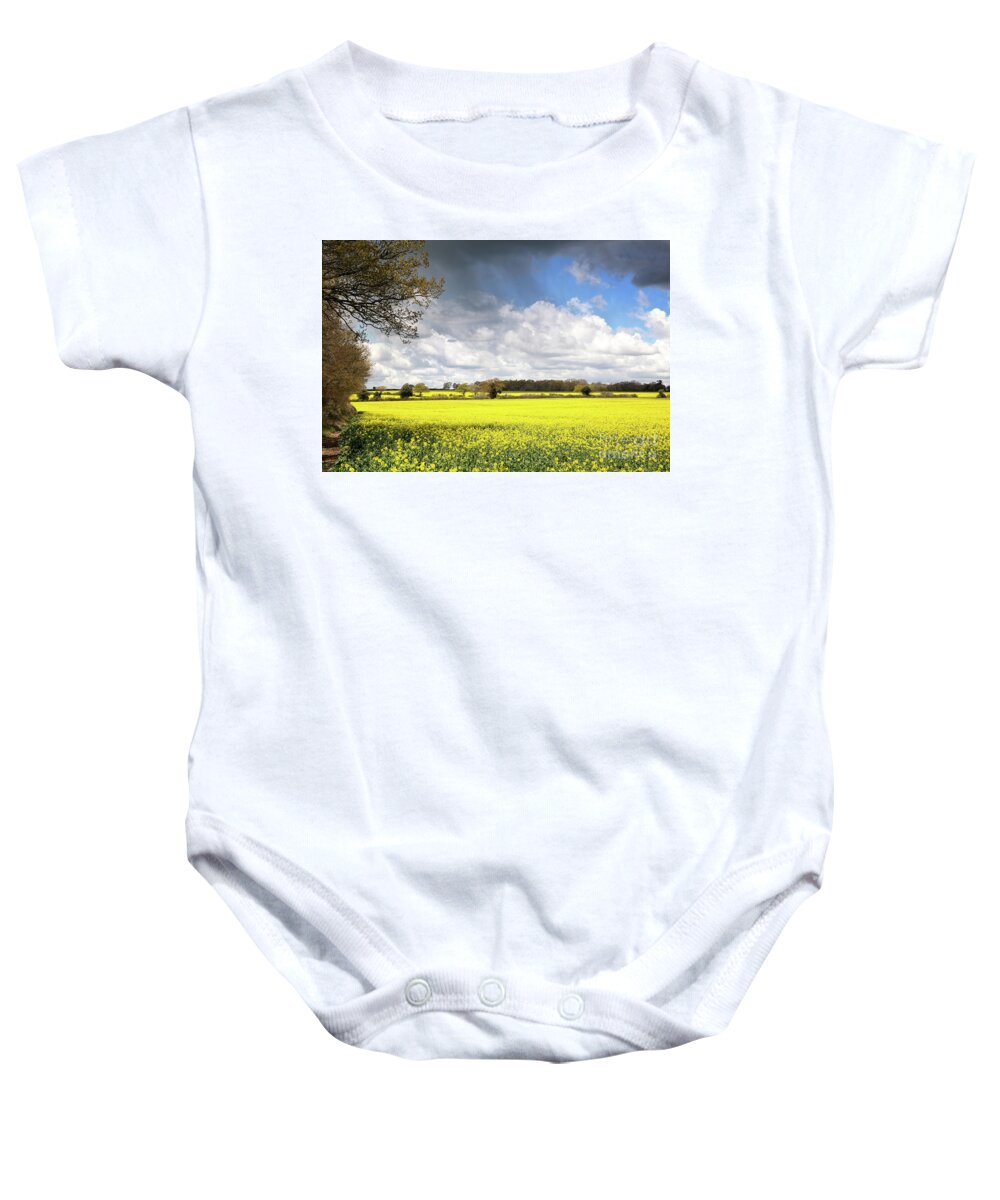 Rape Baby Onesie featuring the photograph A field of rape flowers by Jane Rix