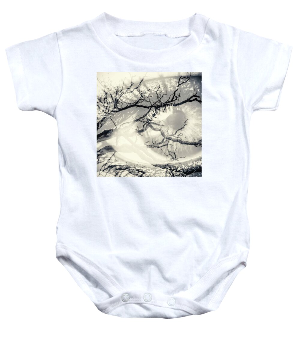 Artsy Baby Onesie featuring the photograph A Single Human Eye Peers Out From The by John Williams