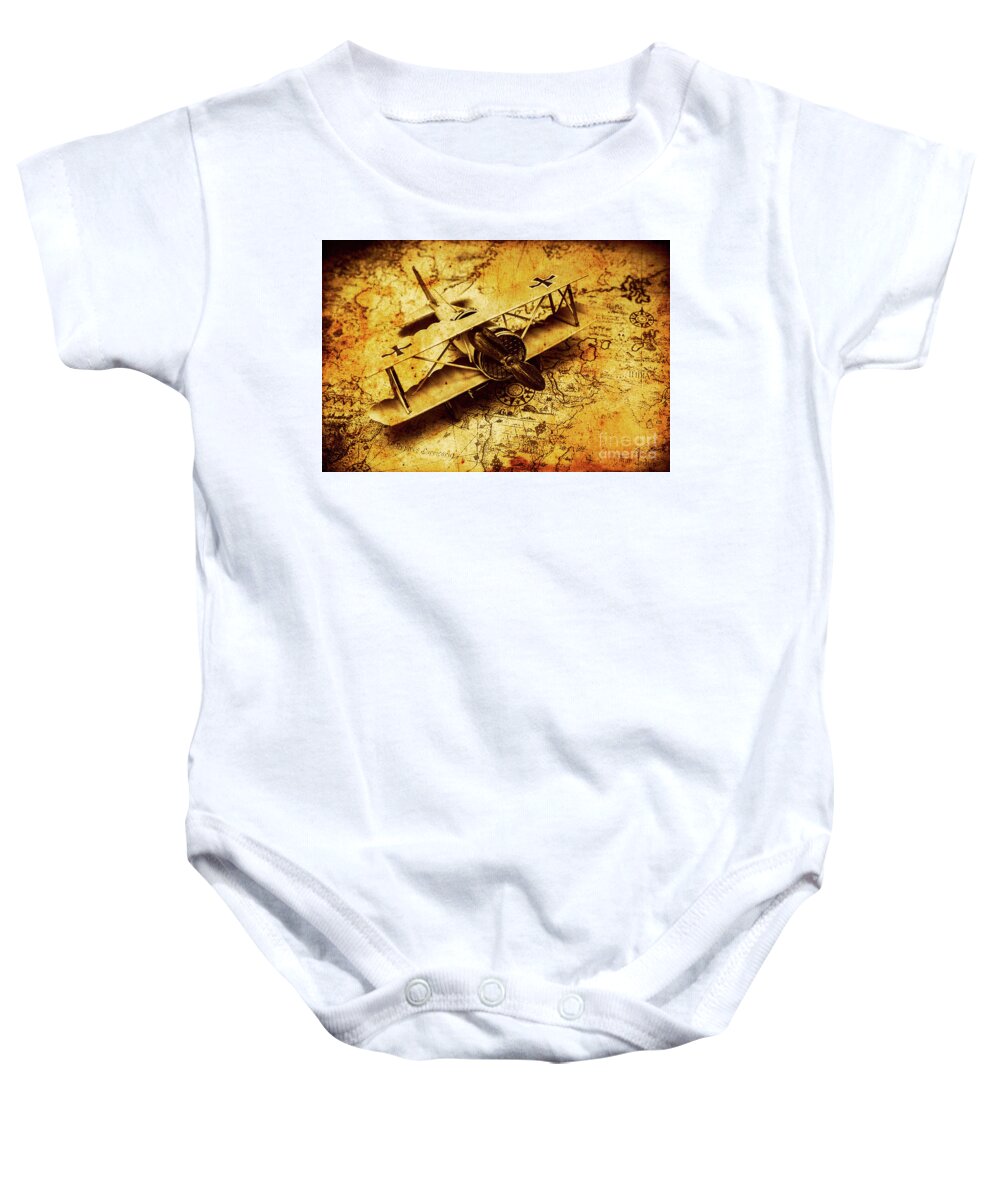 Airplane Baby Onesie featuring the photograph Airplane war bomber miniature on vintage map by Jorgo Photography