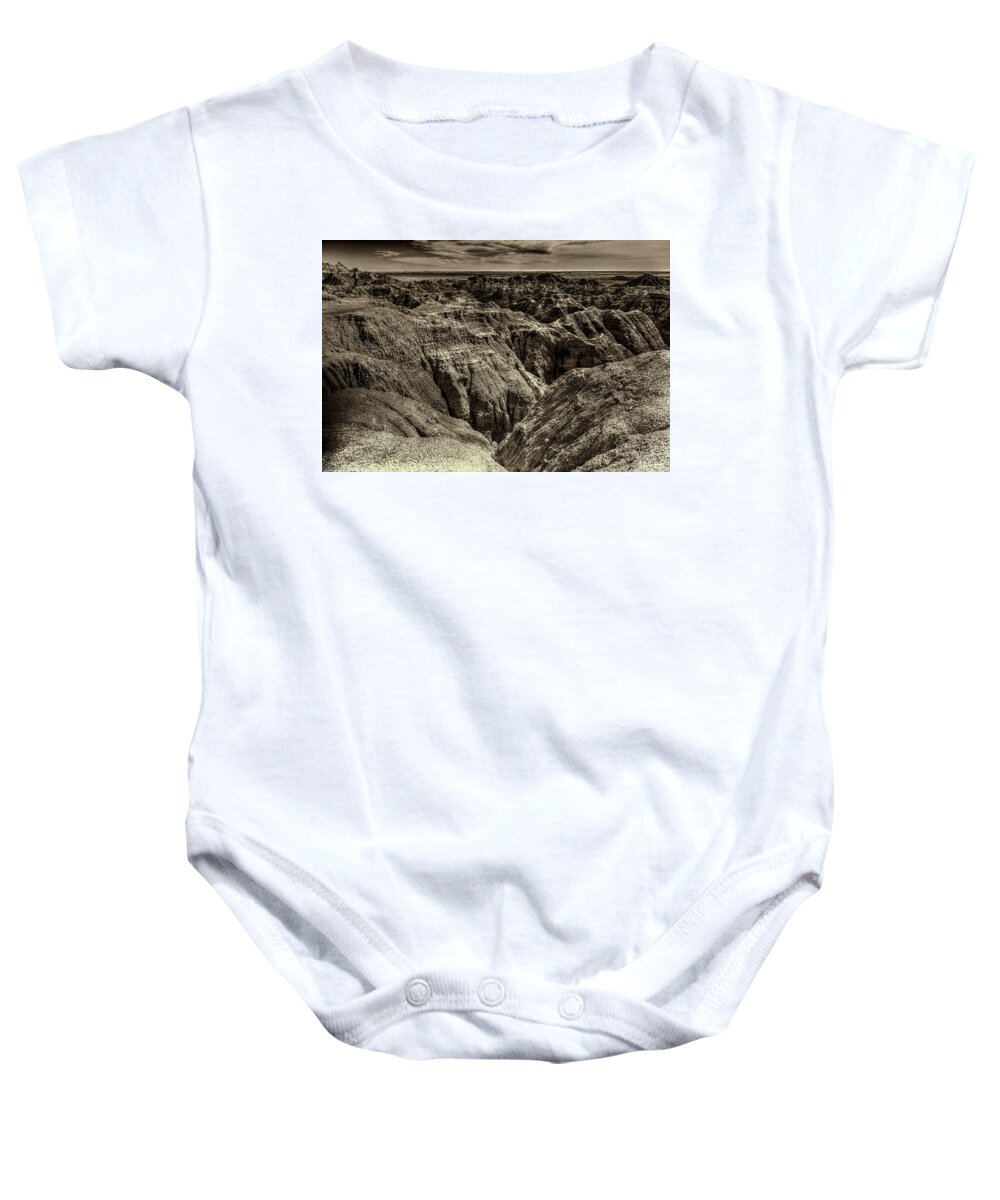 Badlands Baby Onesie featuring the photograph Badlands Sepia by Norman Reid