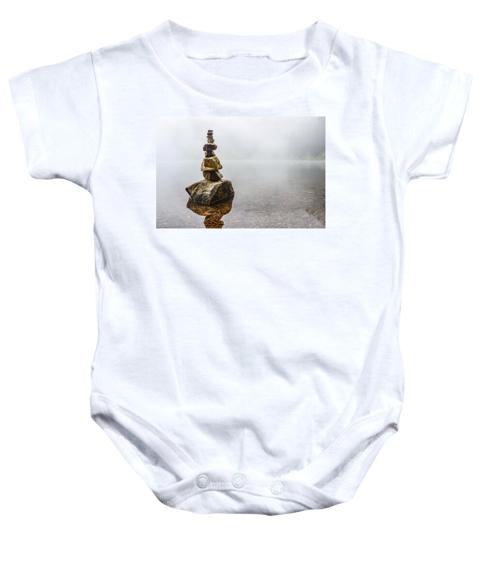 Concept Baby Onesie featuring the photograph Cairn in a Foggy Lake by Pelo Blanco Photo