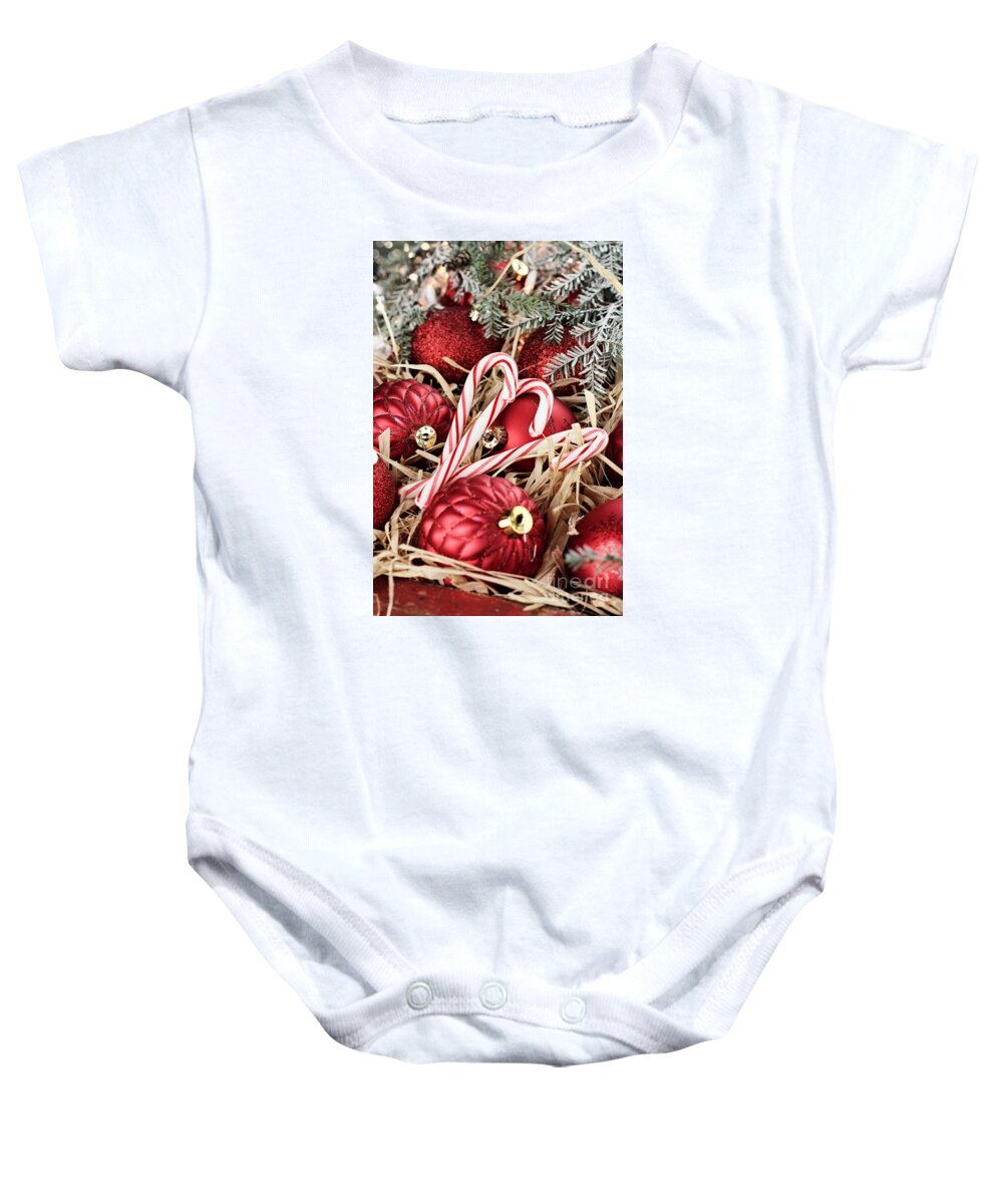 Canes Baby Onesie featuring the photograph Candy Canes and Red Christmas Ornaments by Stephanie Frey
