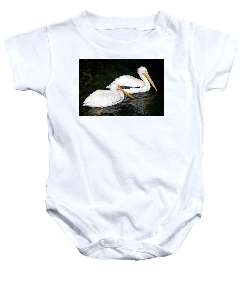 Ft. Worth Baby Onesie featuring the photograph Pelican Swim by Kenny Glover