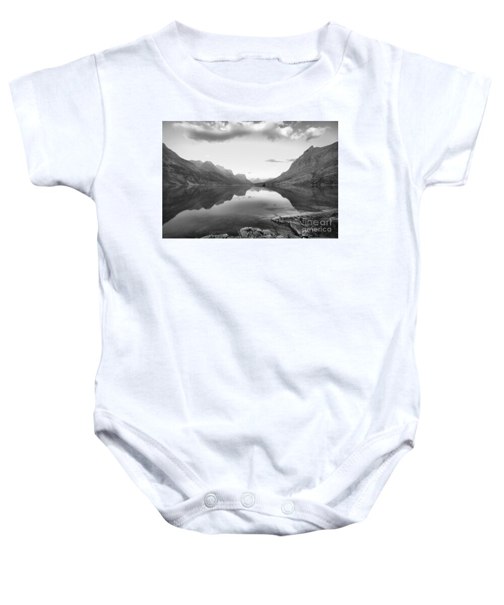 St Mary Lake Baby Onesie featuring the photograph St Mary Lake Clouds And Calm Water Black And White by Adam Jewell