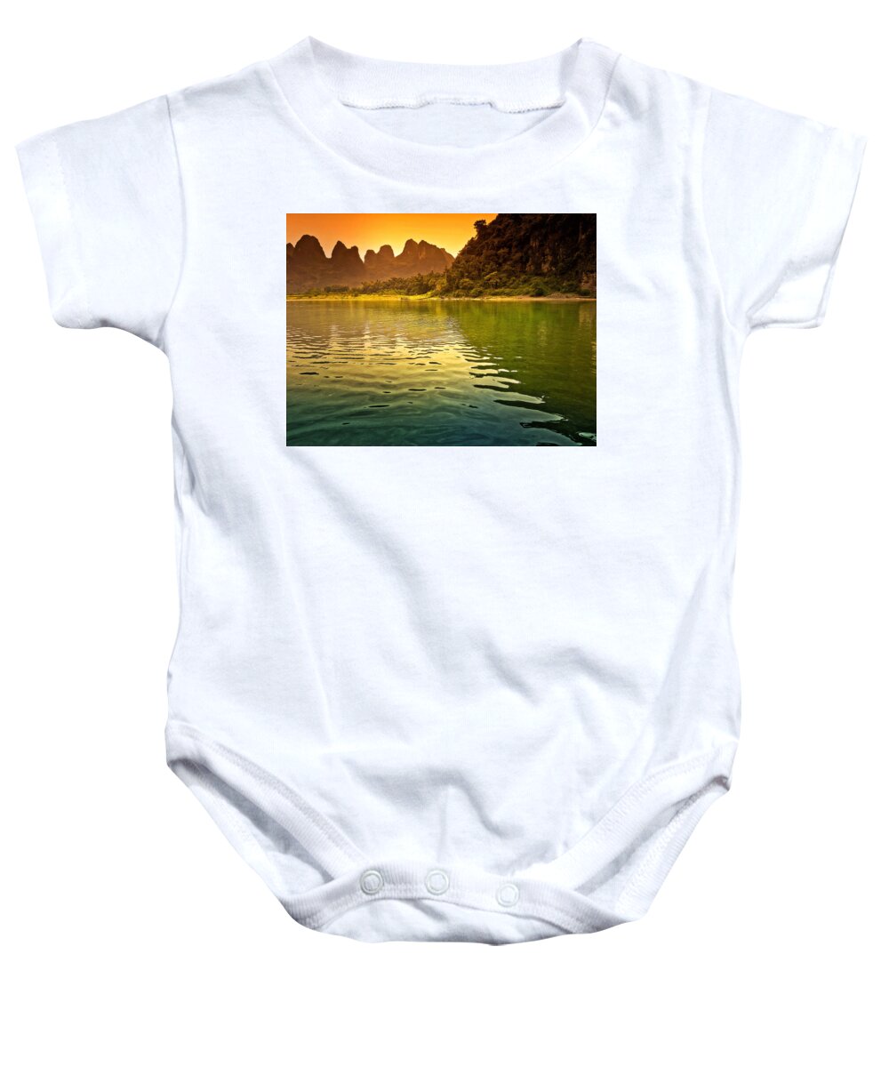 Sunset Baby Onesie featuring the photograph The sun goes down on the mountain-China Guilin scenery Lijiang River in Yangshuo by Artto Pan