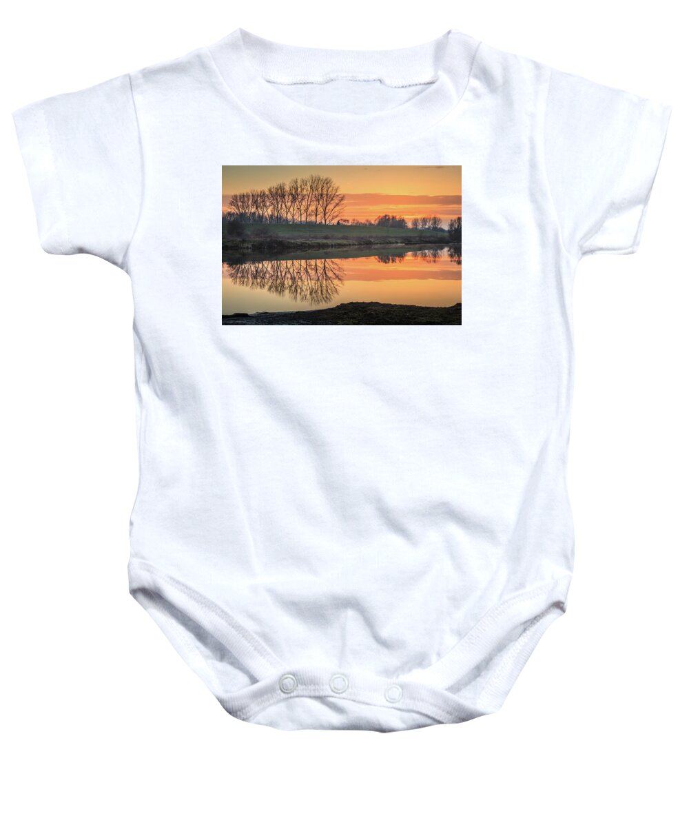 Reflection Baby Onesie featuring the photograph Trees reflection in the water at sunset in Meinerswijk by Tim Abeln