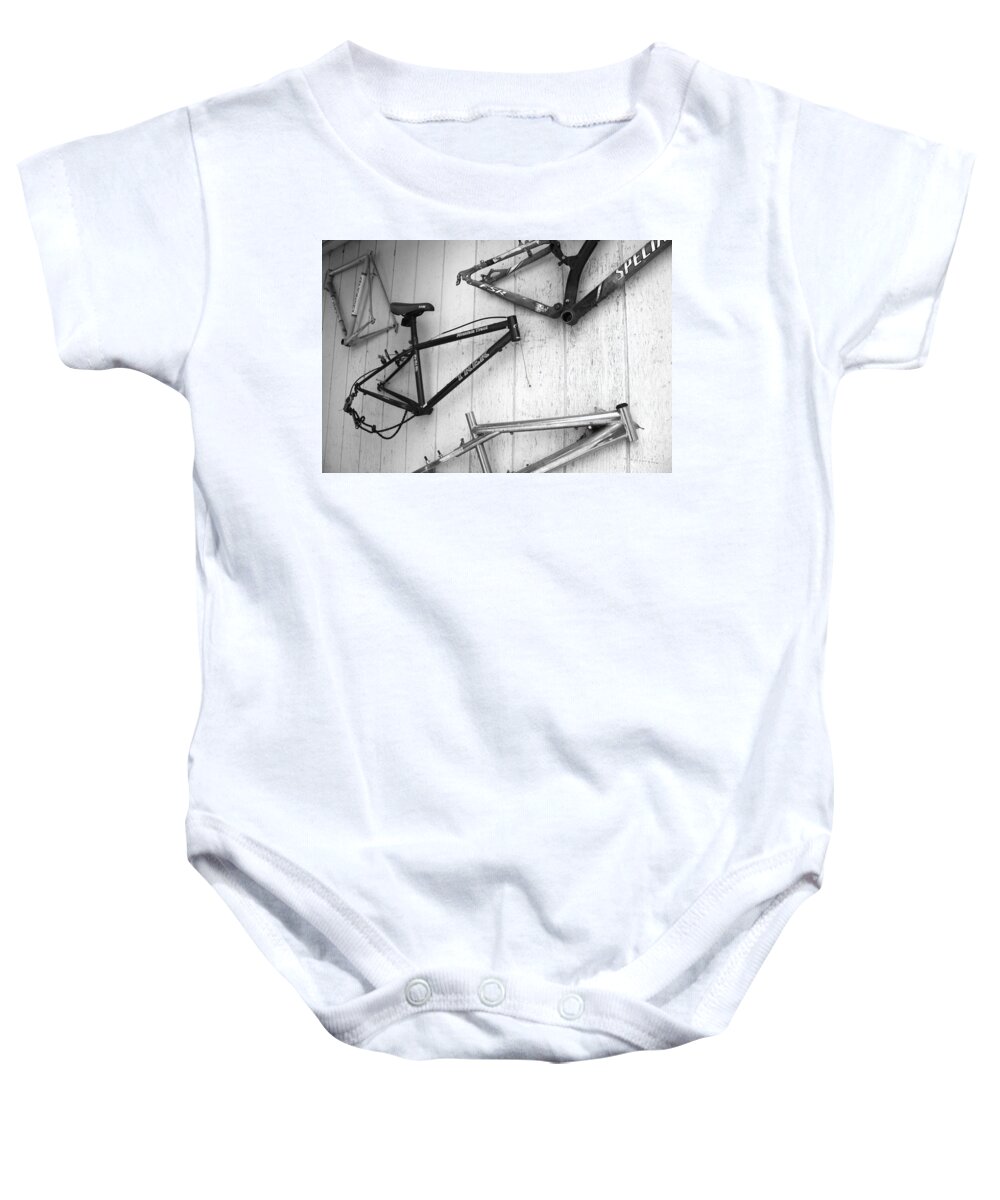 Mountain Bike Frames Baby Onesie featuring the photograph Well Worn Mountain Bike Frames by Gray Artus