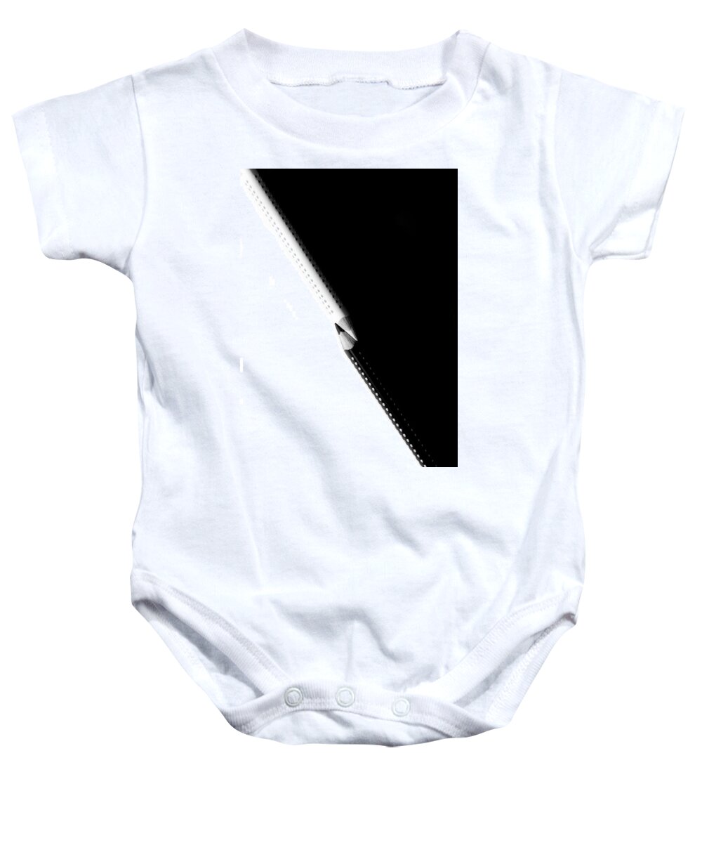 Education Baby Onesie featuring the photograph Two drawing pencils on a black and white surface. by Michalakis Ppalis