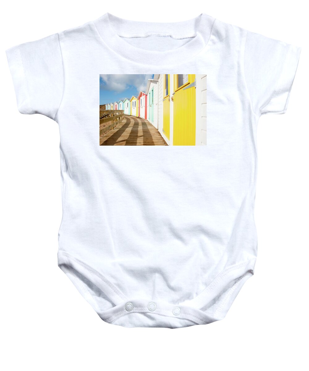 Beach Huts Baby Onesie featuring the photograph Colourful Bude Beach Huts by Helen Jackson