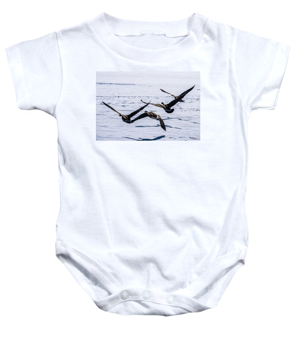 Geese Baby Onesie featuring the photograph Geese over Frozen Kitring Pond by Tim Kathka