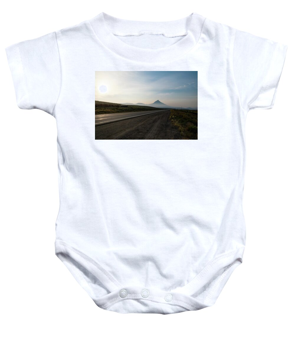 Rural Baby Onesie featuring the photograph Road through the Rockies by Nicole Lloyd