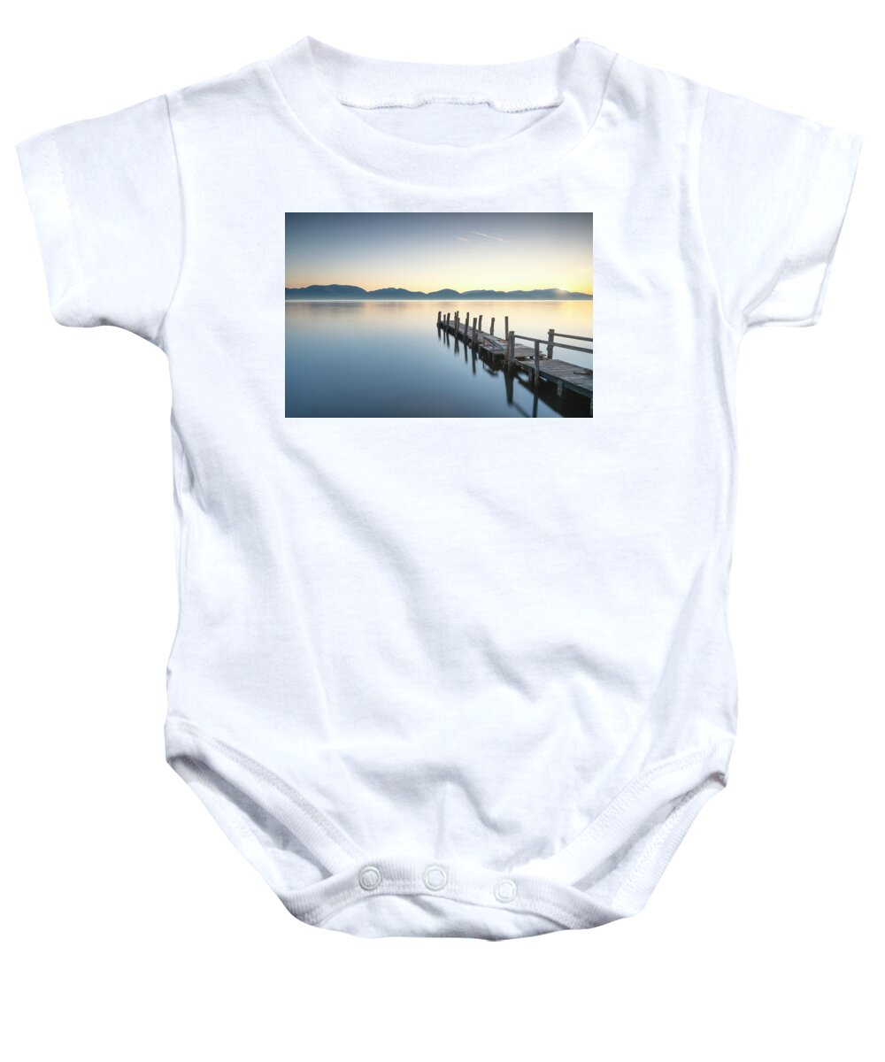 Lake Baby Onesie featuring the photograph Wooden pier or jetty and lake at sunrise. Torre del lago Puccini #3 by Stefano Orazzini
