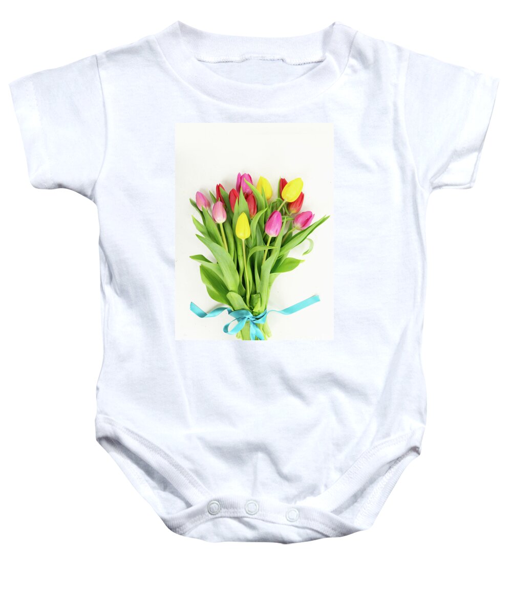 Easter Baby Onesie featuring the photograph Pink, yeelow and violet tulips flowers by Anastasy Yarmolovich