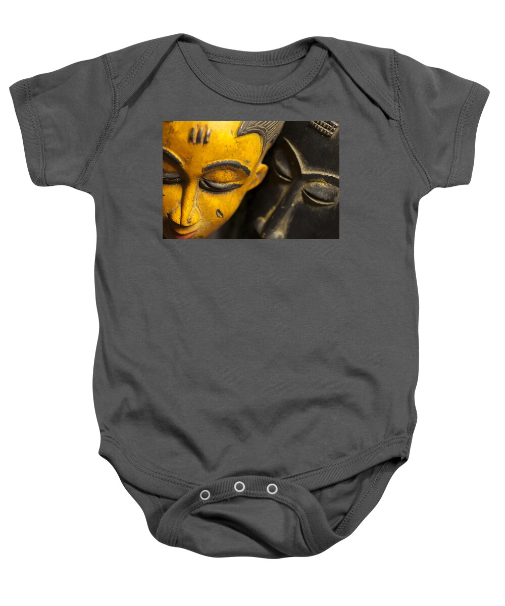 Abstract Baby Onesie featuring the photograph African Masks by Raul Rodriguez