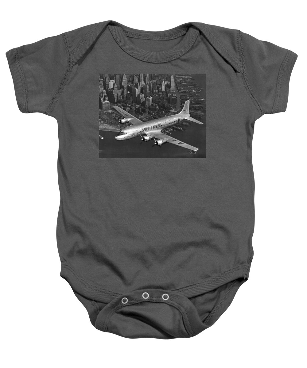 1940's Baby Onesie featuring the photograph American DC-6 Flying Over NYC by Underwood Archives