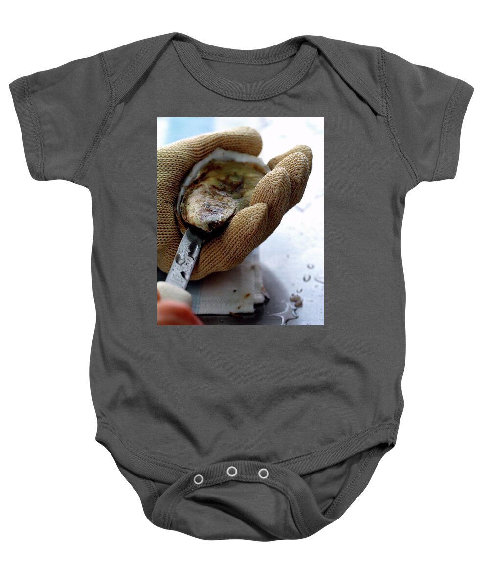Cooking Baby Onesie featuring the photograph An Oytser Being Shucked by Romulo Yanes