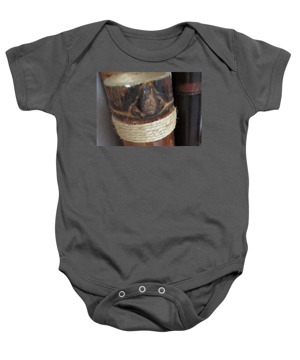 Bamboo Baby Onesie featuring the photograph Bamboo Node on Rain Stick by Ashley Goforth
