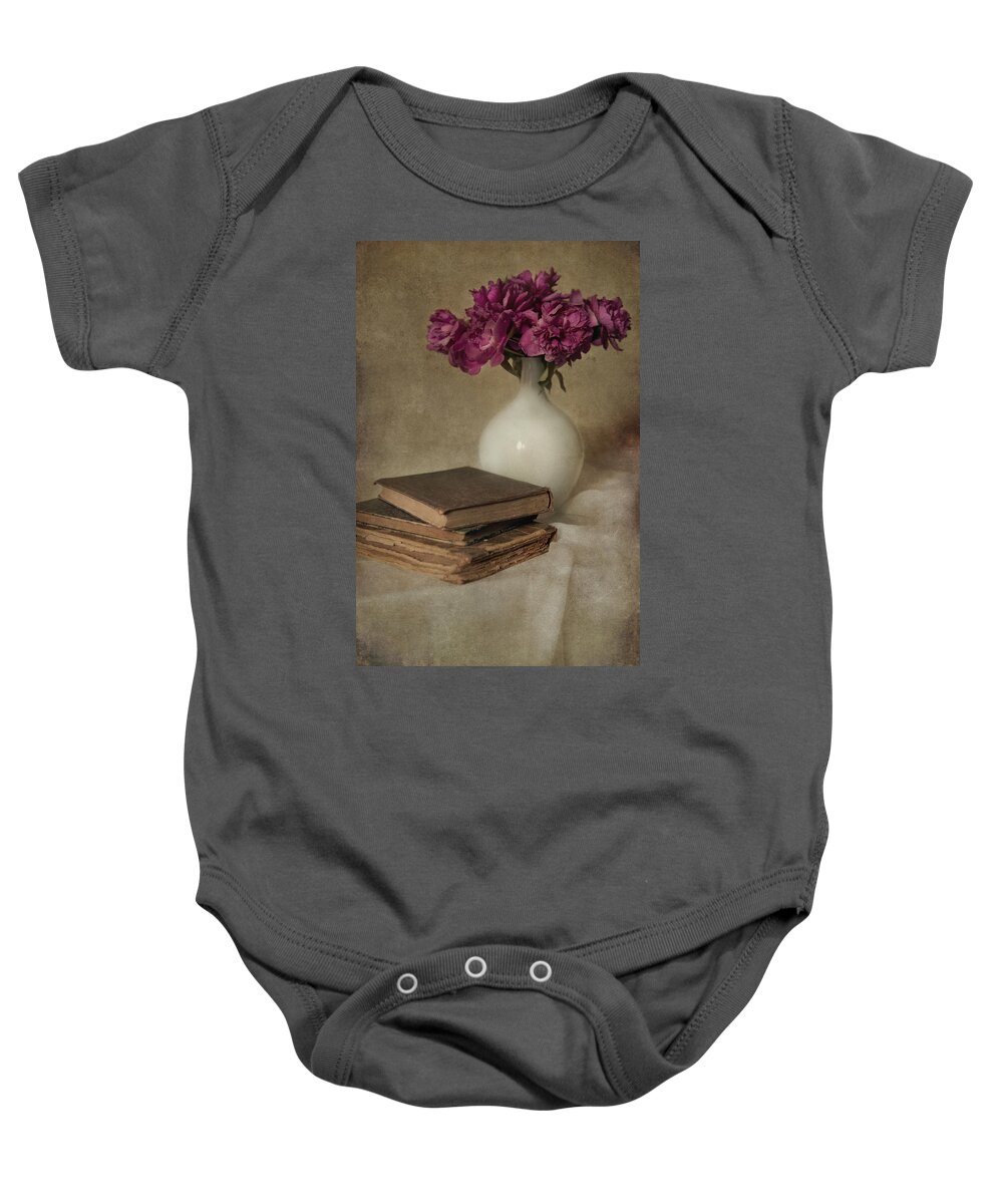 Vase Baby Onesie featuring the photograph Bouquet of peonies and old books by Jaroslaw Blaminsky