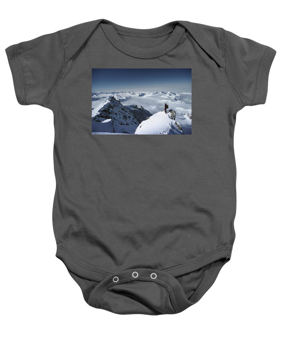 Feb0514 Baby Onesie featuring the photograph Climber On The Summit Of Mt Shinn by Colin Monteath