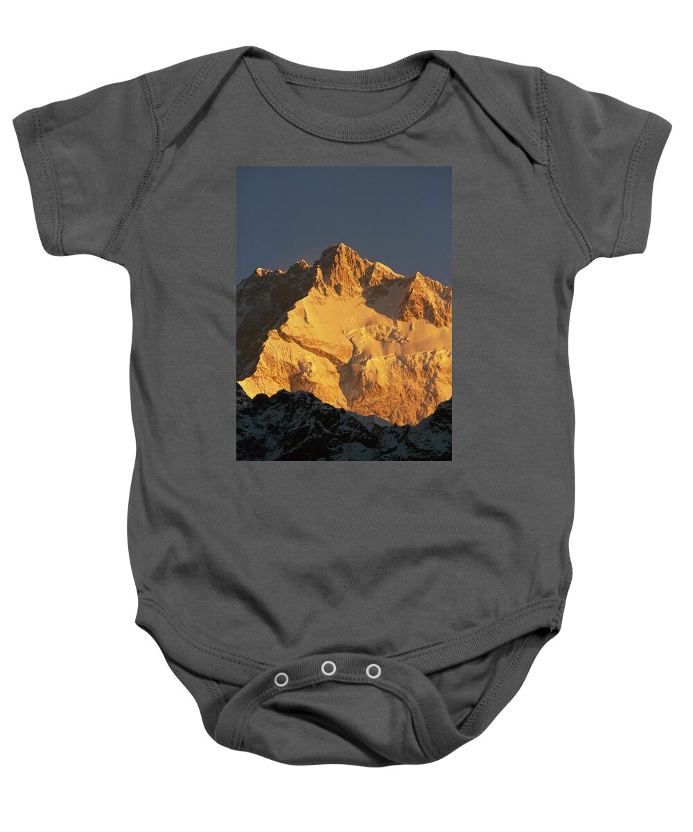 Hh Baby Onesie featuring the photograph Dawn On Kangchenjunga Talung Face by Colin Monteath