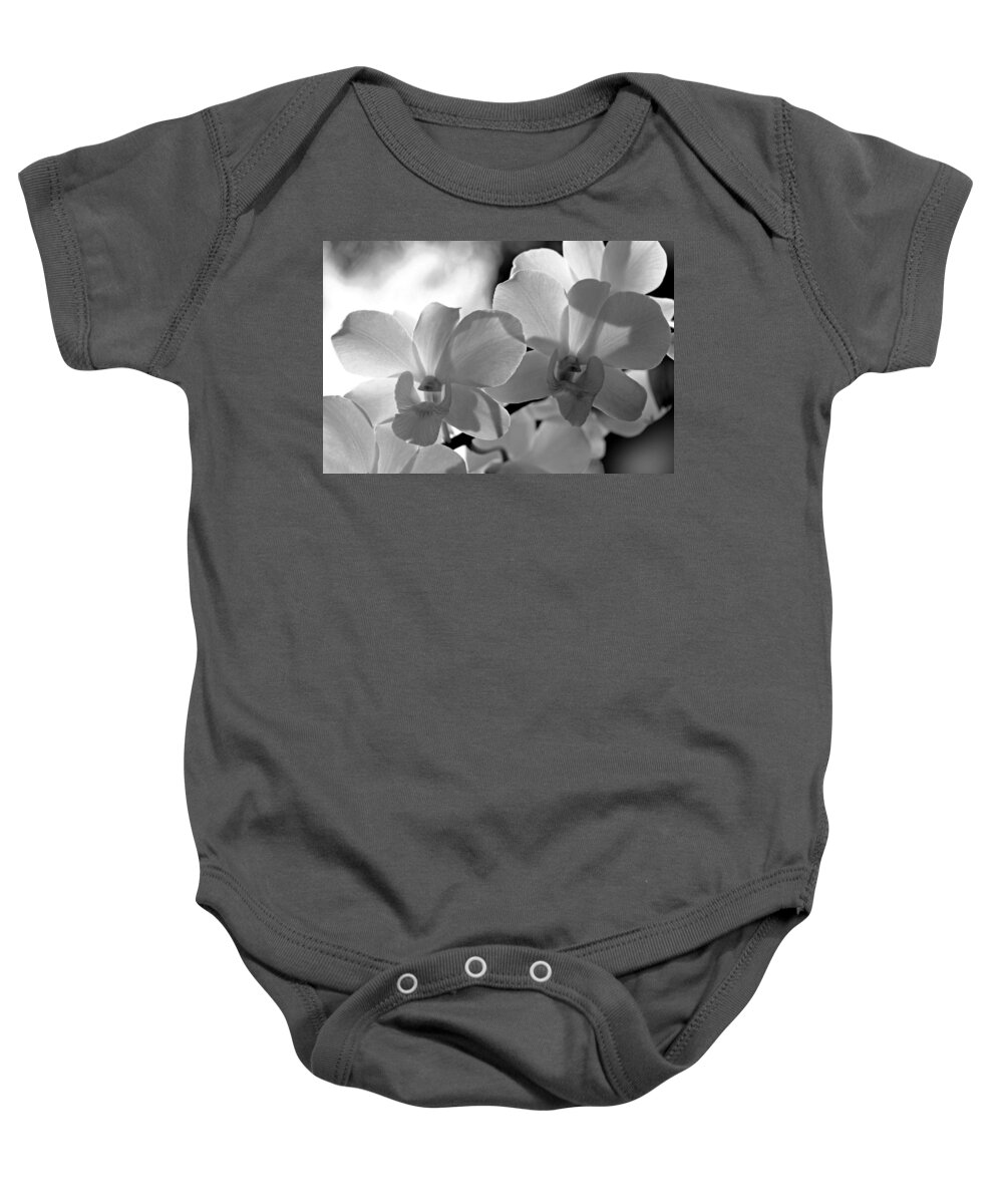 Orchids Baby Onesie featuring the photograph Hit by Light. White Orchids by Jenny Rainbow