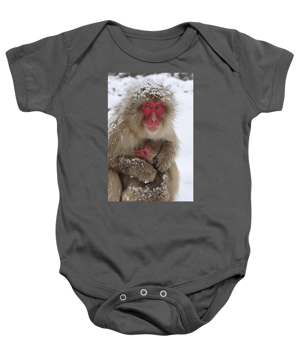 Thomas Marent Baby Onesie featuring the photograph Japanese Macaque Warming Baby by Thomas Marent