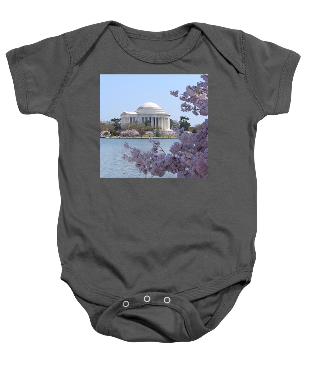 Landmarks Baby Onesie featuring the photograph Jefferson Memorial - Cherry Blossoms by Mike McGlothlen