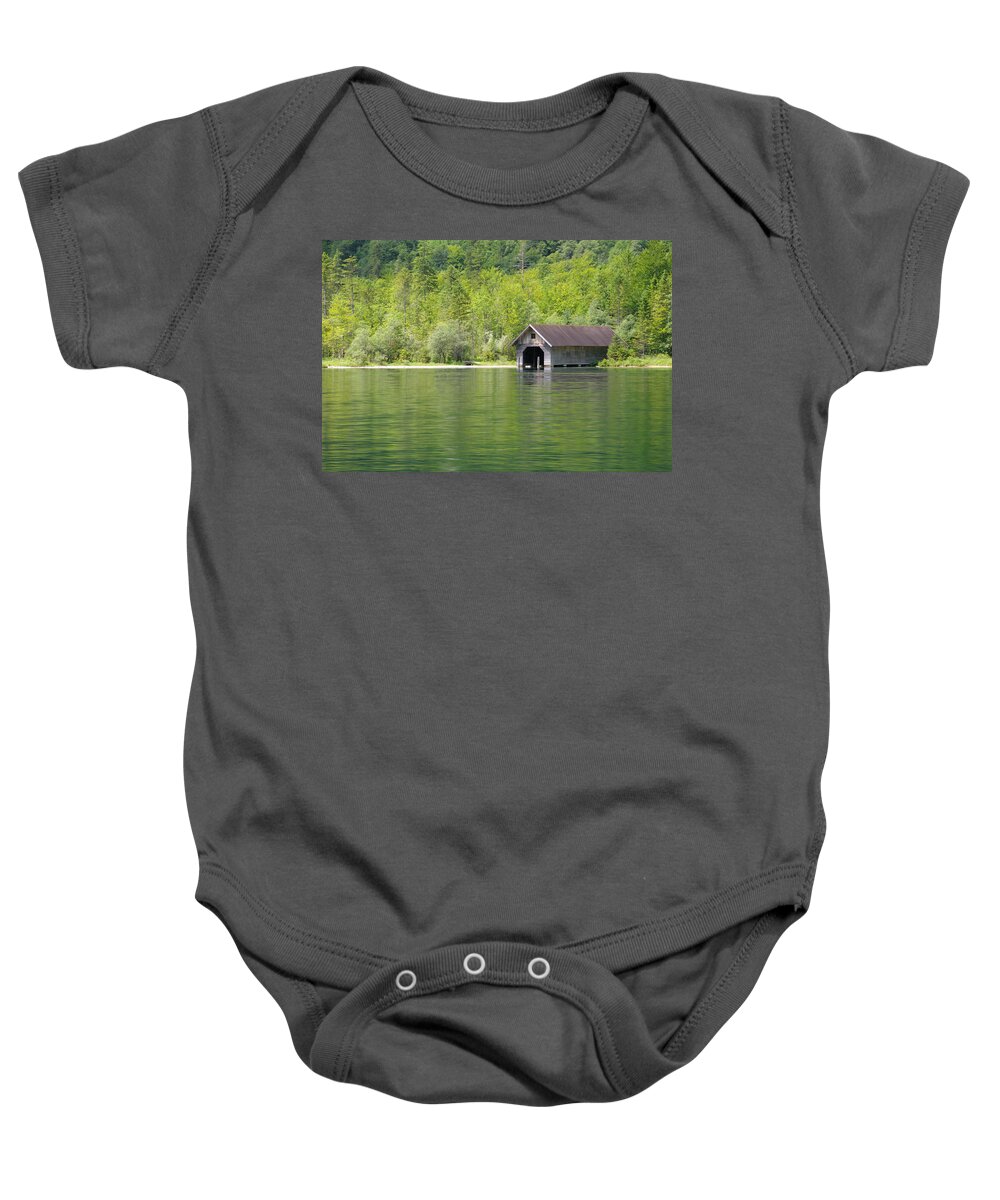  Lake Baby Onesie featuring the photograph Konigsee Boathouse by Jeremy Voisey
