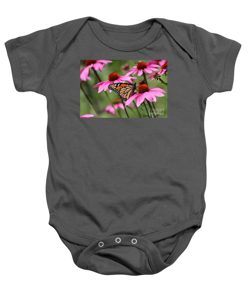 Monarch Baby Onesie featuring the photograph Monarch and Conflowers by Karen Adams