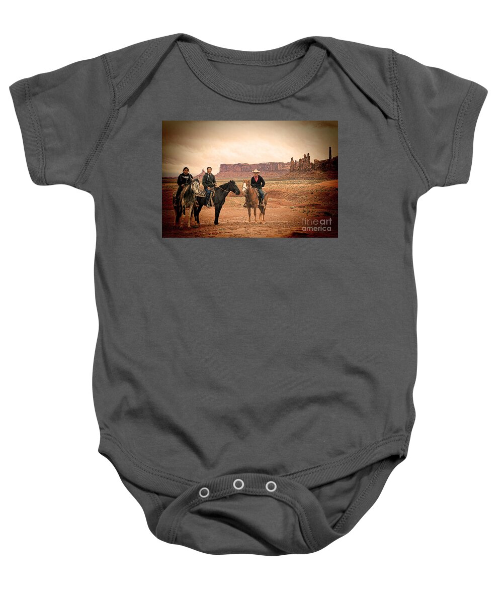 Red Soil Baby Onesie featuring the photograph Navajo Riders by Jim Garrison