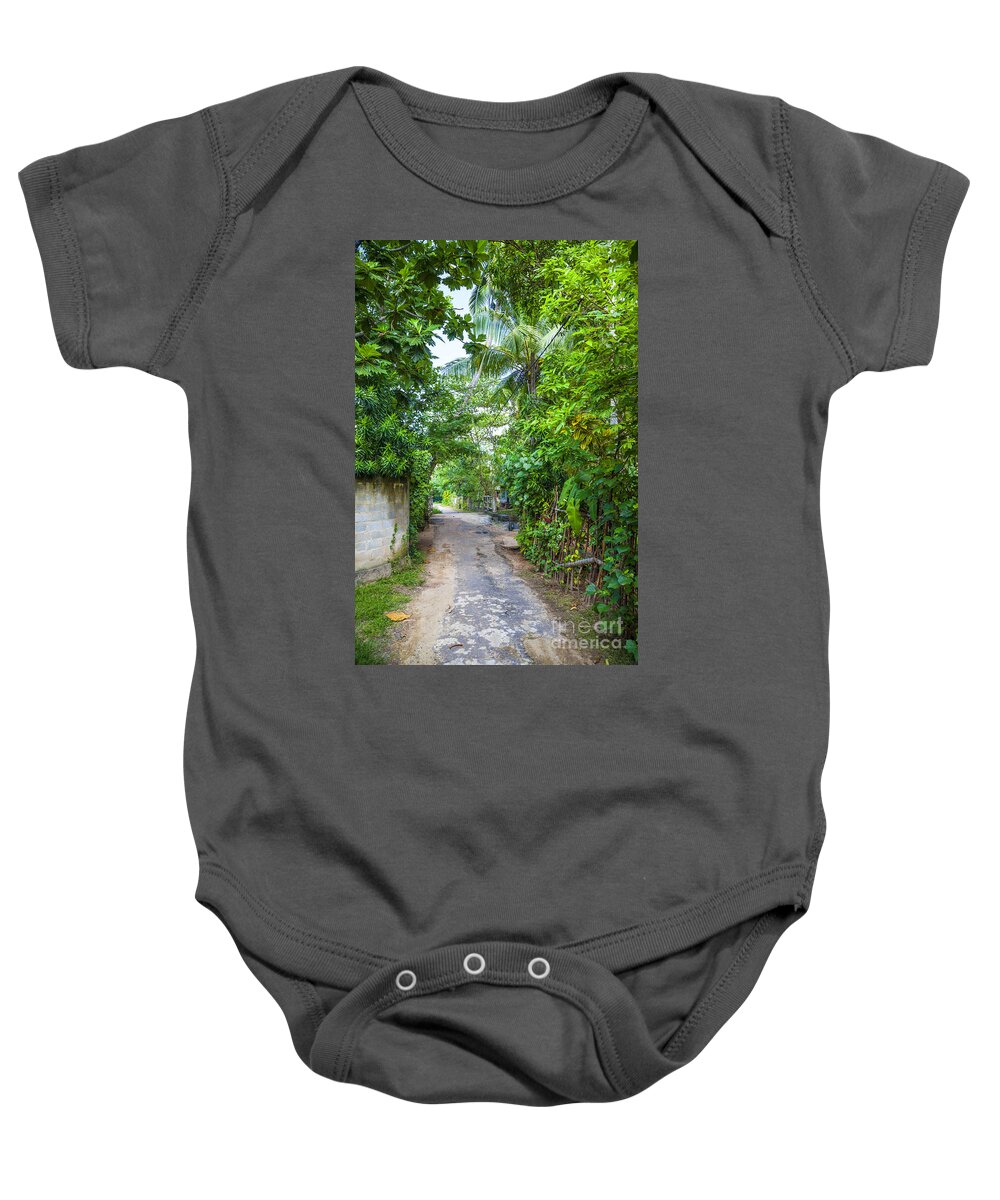 Jungle Baby Onesie featuring the photograph road in the Sri Lanka jungle by Gina Koch