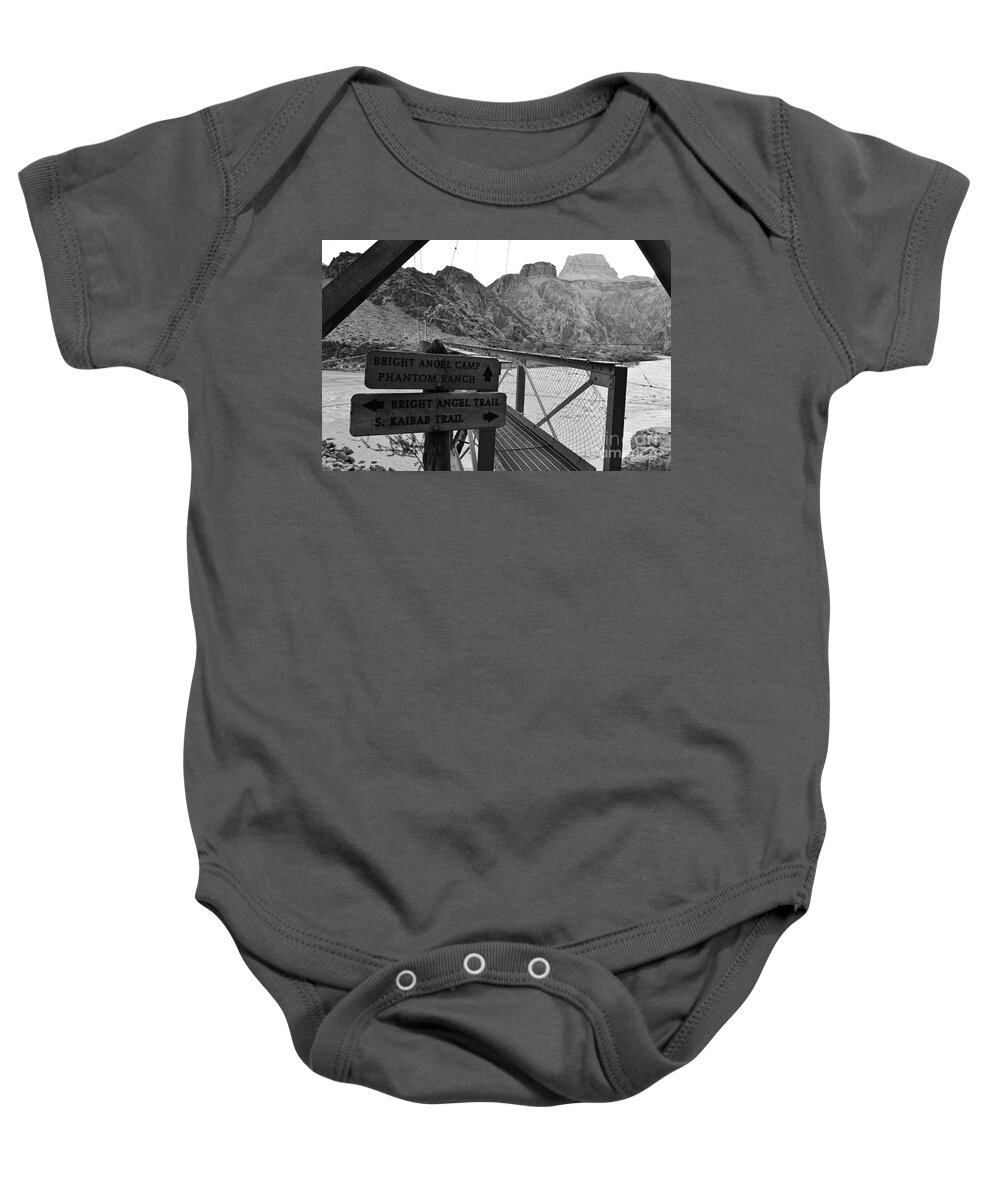 Grand Canyon Baby Onesie featuring the photograph Silver Bridge Signs over Colorado River at bottom of Grand Canyon National Park Black and White by Shawn O'Brien