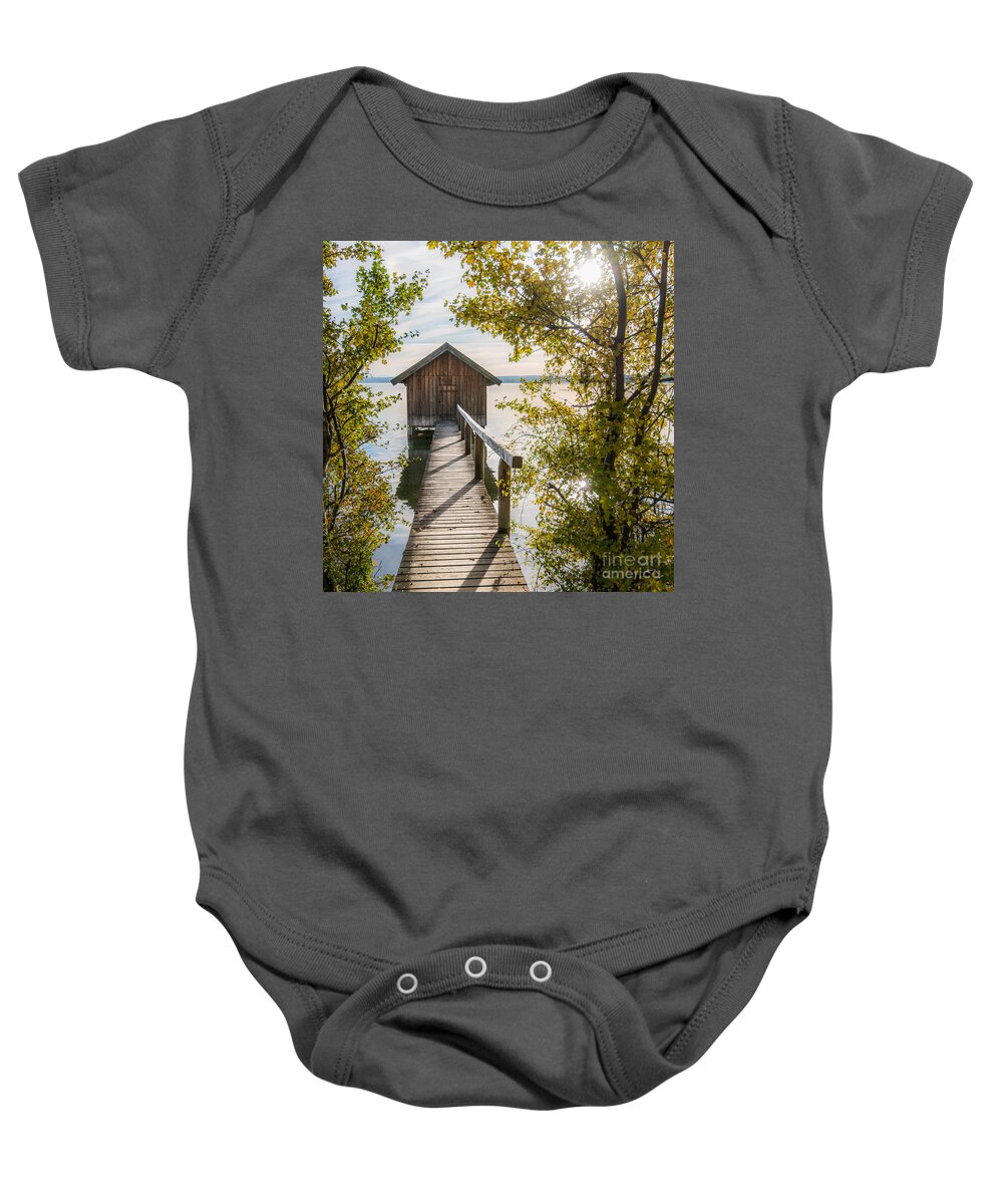 Ammersee Baby Onesie featuring the photograph The waterhouse in fall by Hannes Cmarits