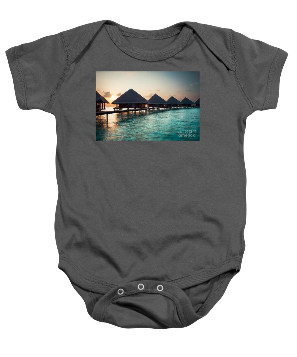 Amazing Baby Onesie featuring the photograph Waterbungalows At Sunset by Hannes Cmarits