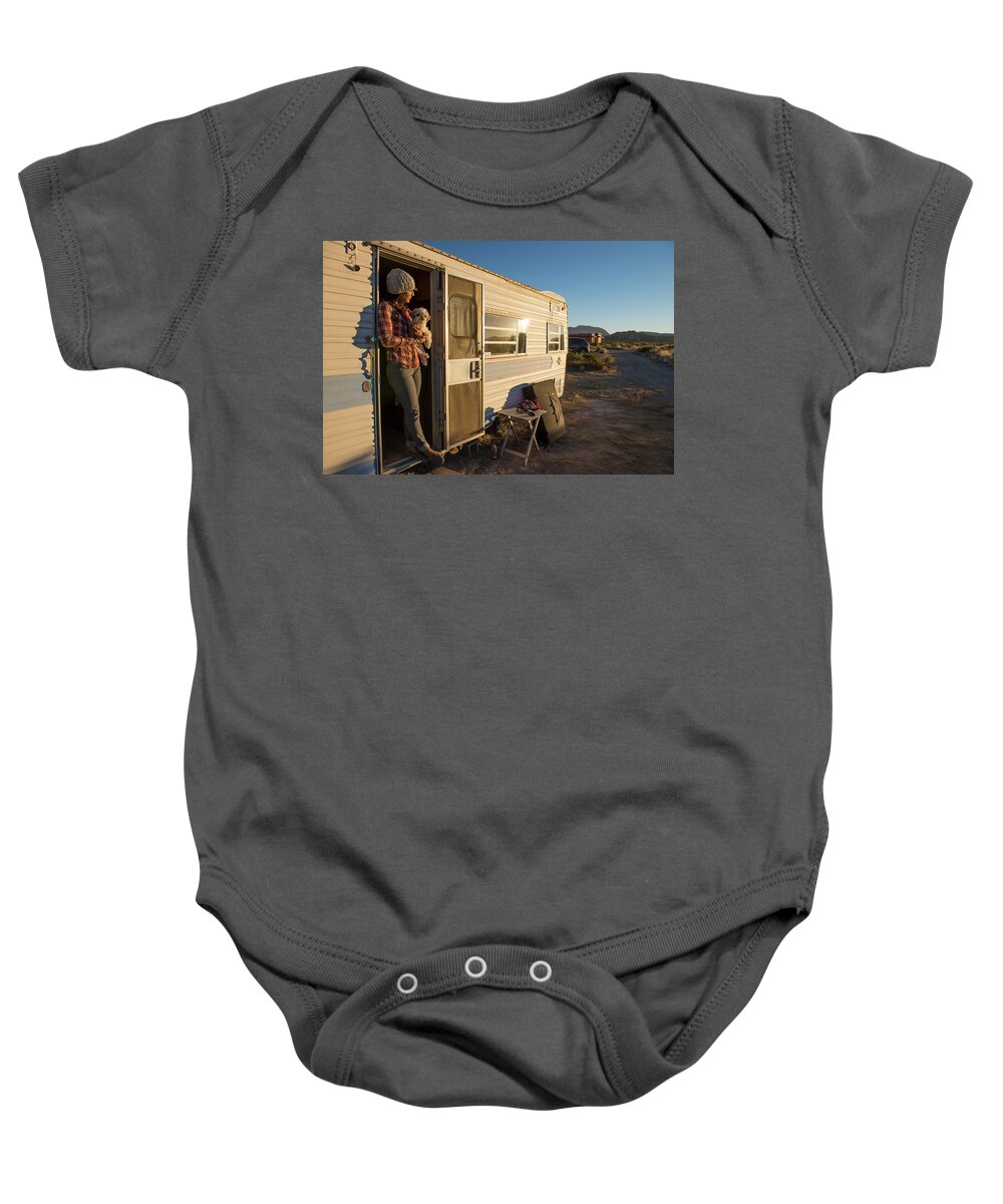 Adventure Baby Onesie featuring the photograph Woman Leaning In Camper Door Way by Jacob Bodkin