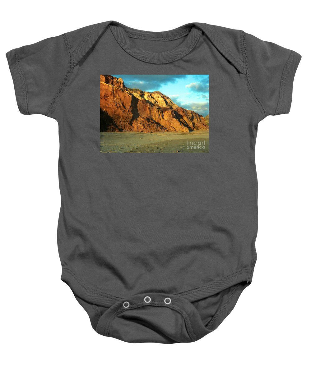 Beach At Sunset Baby Onesie featuring the photograph Beach Cliff at Sunset by Mark Dodd