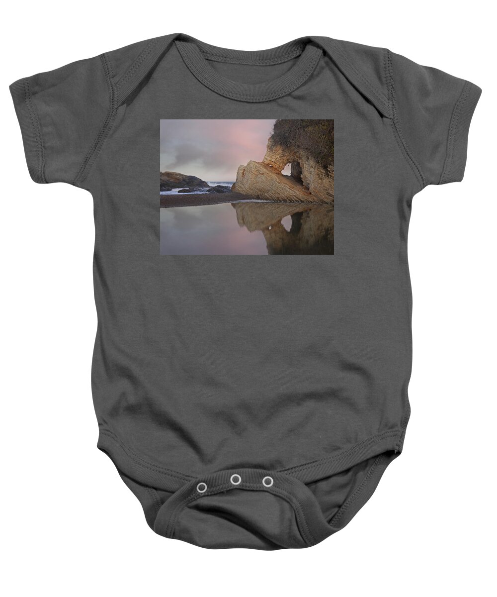 00443040 Baby Onesie featuring the photograph Cave Reflected In Pool At Dusk Spooners by Tim Fitzharris