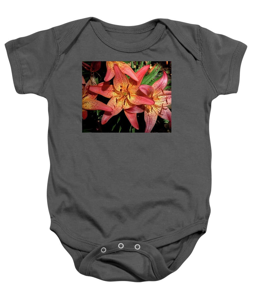 Nature Baby Onesie featuring the photograph Coral Lilies by Peggy Urban