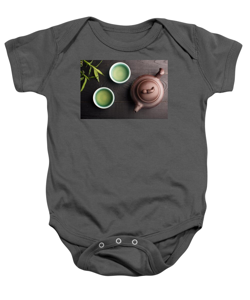 Vadim Goodwill Baby Onesie featuring the photograph Green tea in the tea cups #1 by Vadim Goodwill