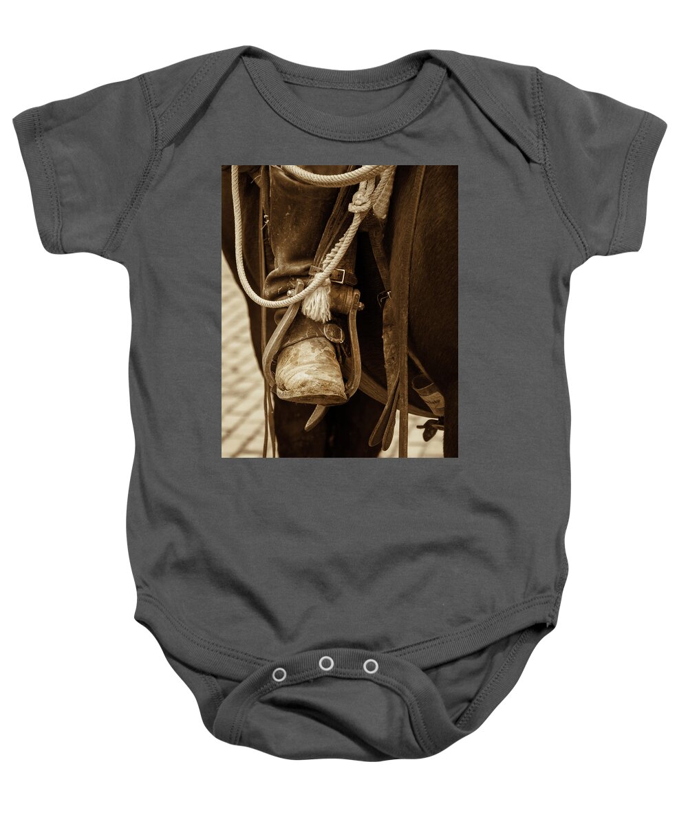 Cowboy Baby Onesie featuring the photograph A Cowboy's Boot by Jeanne May