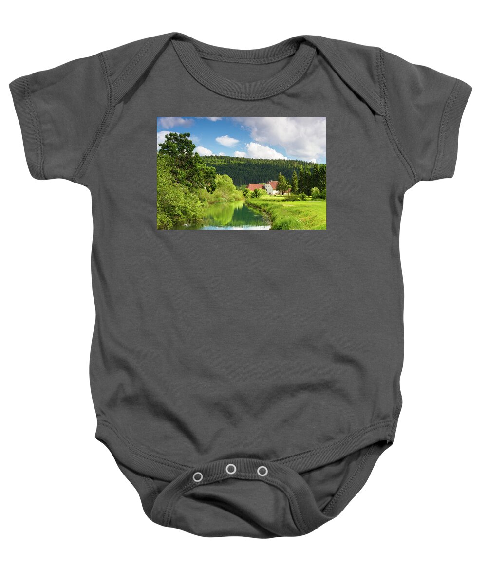 Farm Baby Onesie featuring the photograph A farm in the mountains of Jura by Paul MAURICE