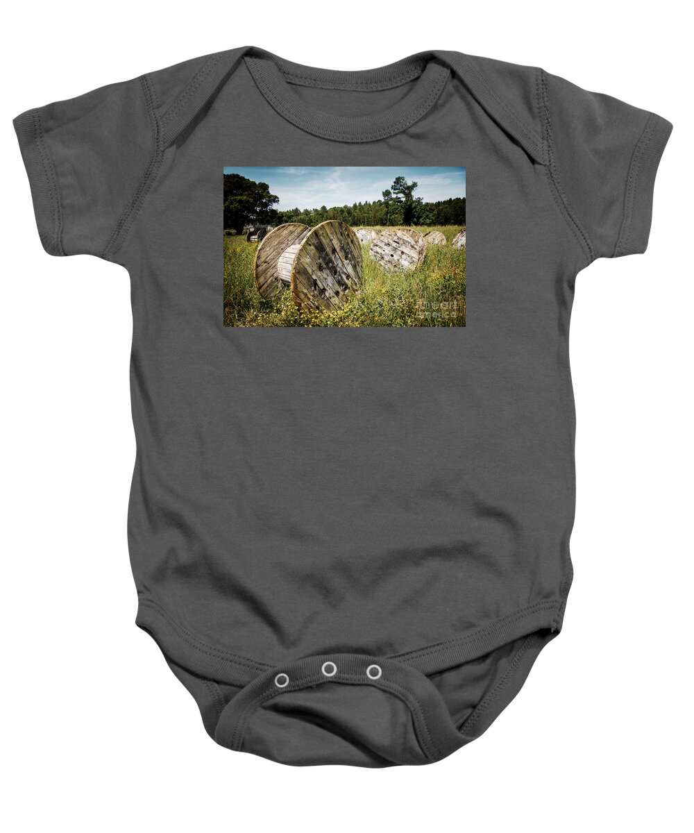 Cable Baby Onesie featuring the photograph Abandoned Cable Reels by Carlos Caetano
