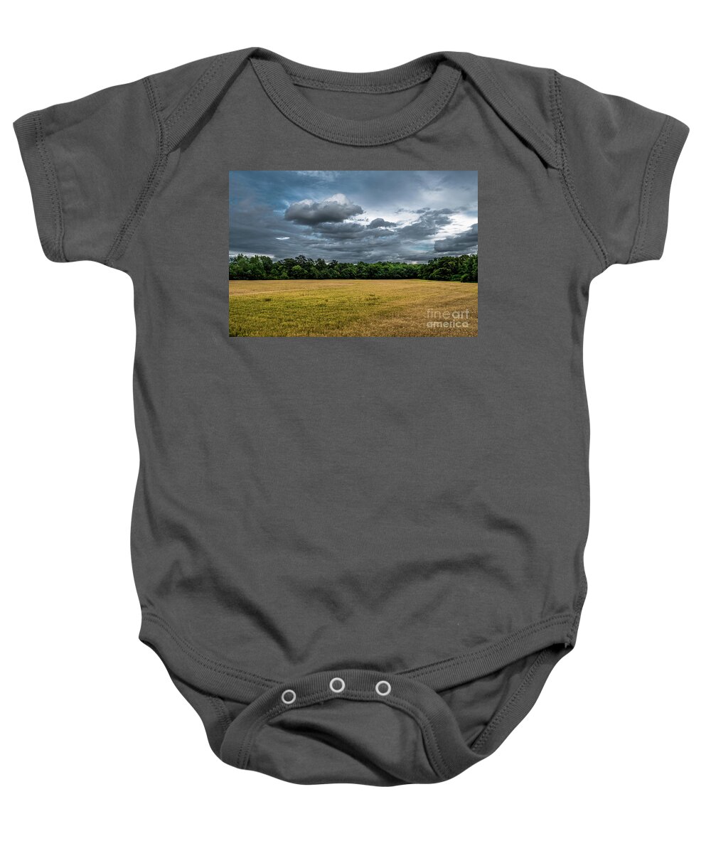 Acre Baby Onesie featuring the photograph Acre with corn with forest and cloudy sky by Andreas Berthold