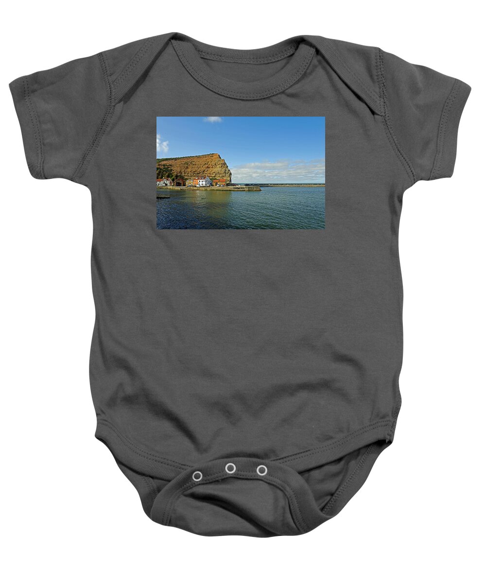 Britain Baby Onesie featuring the photograph Across Staithes Harbour To Cowbar Nab by Rod Johnson