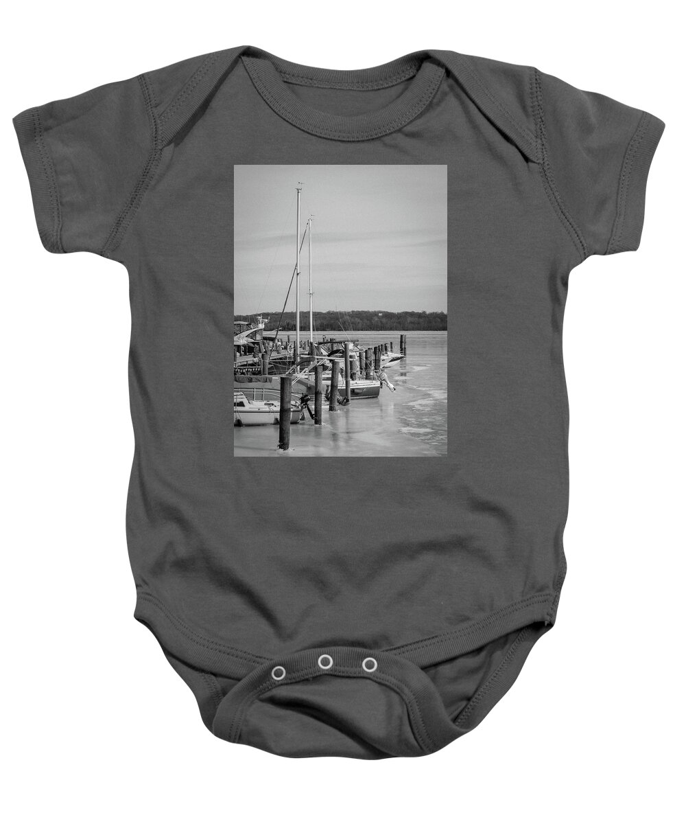 Boats Baby Onesie featuring the photograph Boats In Icy Harbor in Black and White by Liz Albro