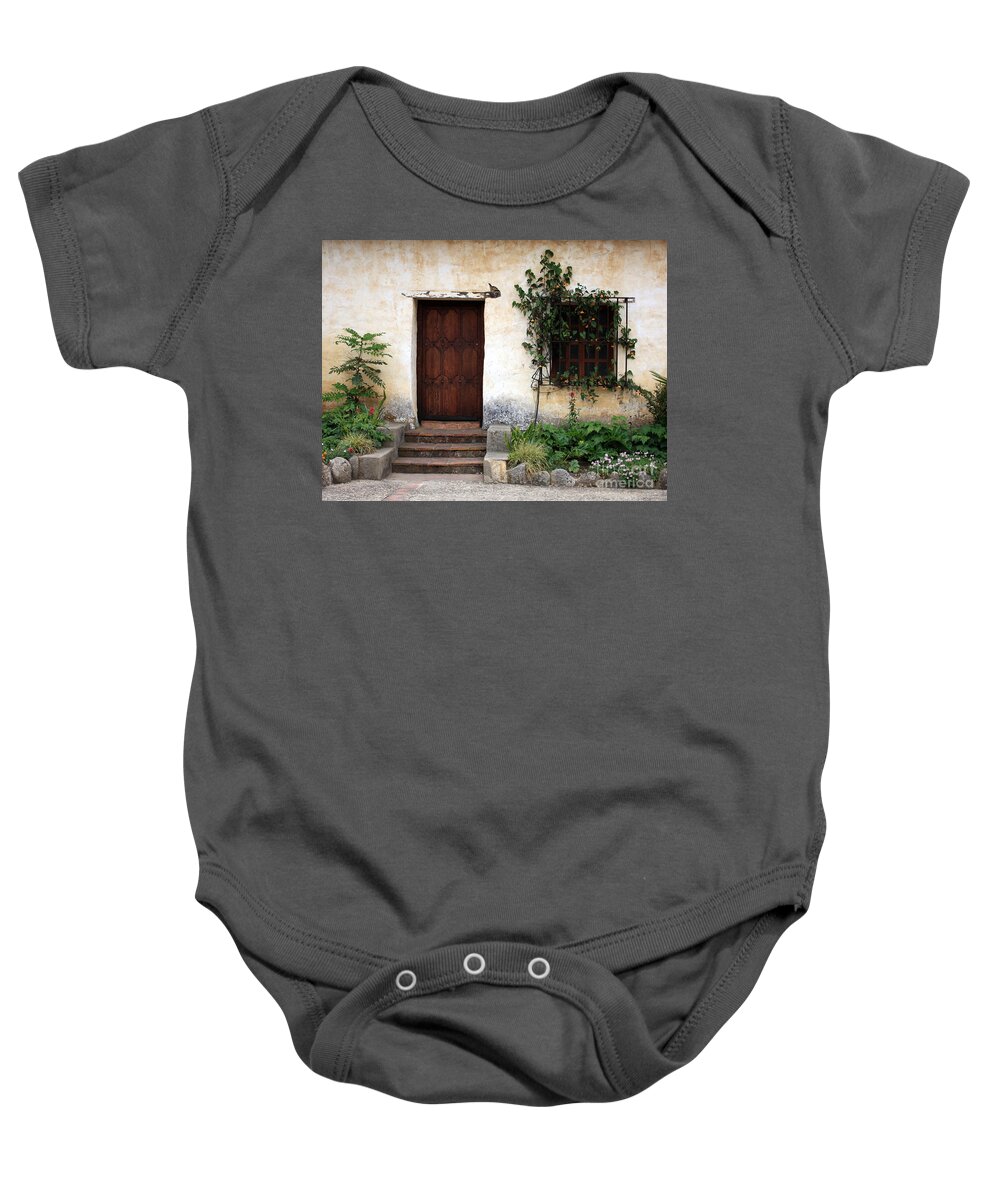 Carmel Mission Baby Onesie featuring the photograph Carmel Mission Door by Carol Groenen
