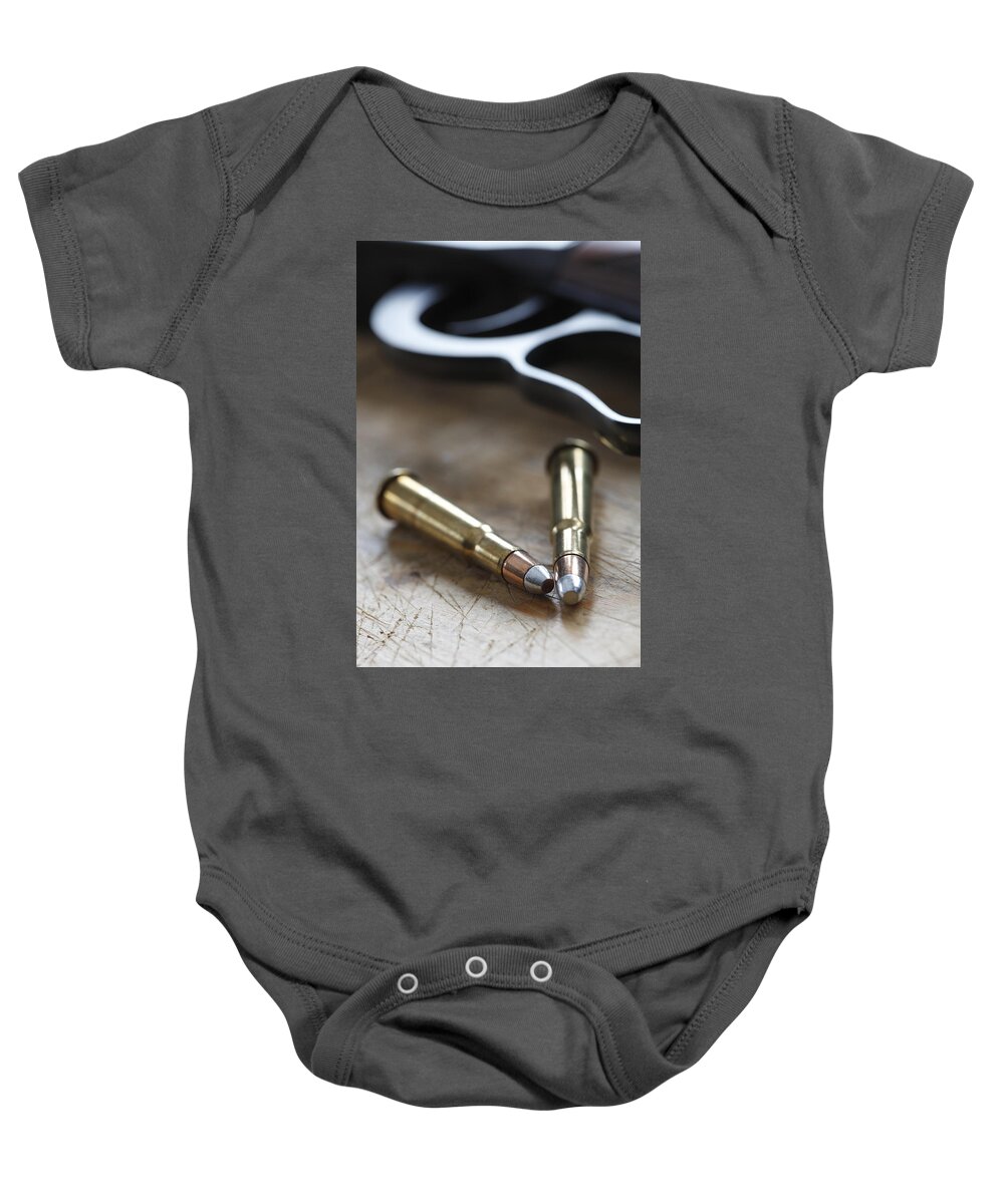 Ammunition Baby Onesie featuring the photograph Cartridges and rifle by Ulrich Kunst And Bettina Scheidulin