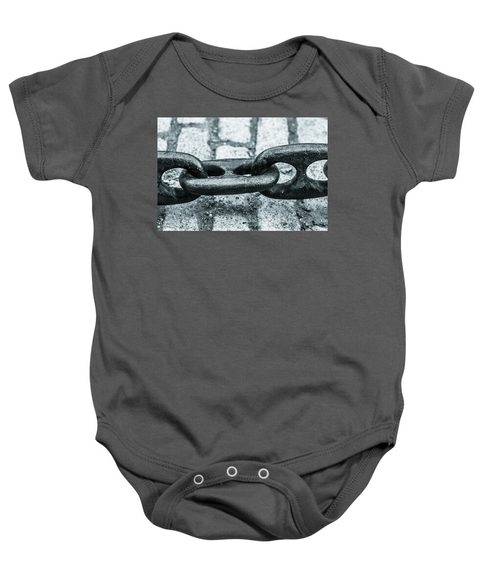 Chain Baby Onesie featuring the photograph Chained brick by Jason Hughes