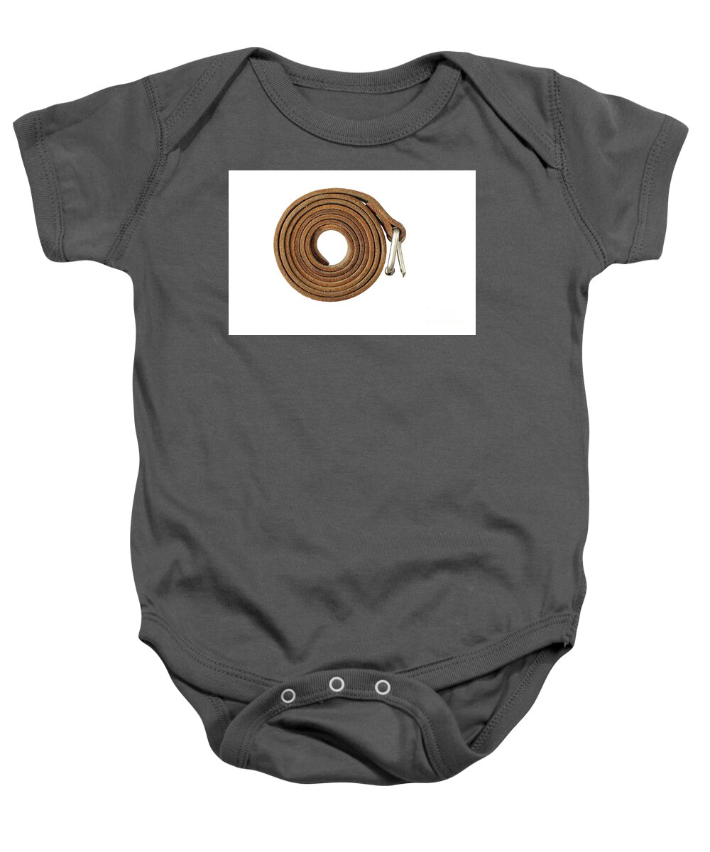 Coiled Baby Onesie featuring the photograph Coiled leather belt on a white background by Michal Boubin
